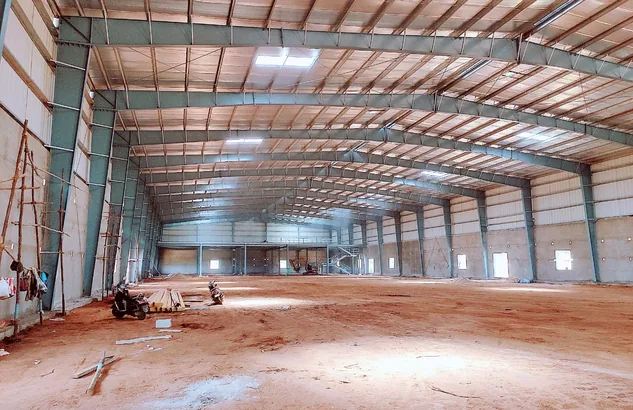 Completed warehouse interior with roof and mezzanine